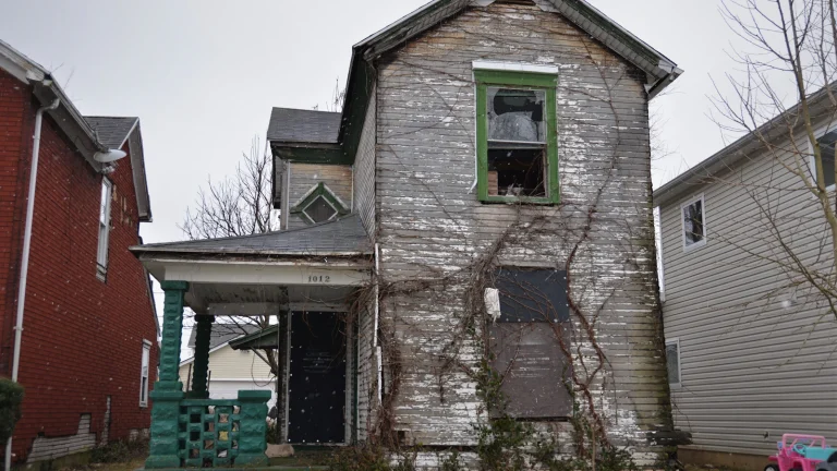 A worn, run-down house that needs repairs before it could be listed